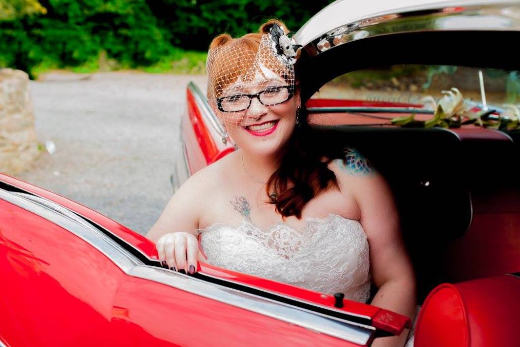 Halloween Rockabilly Themed Wedding - Bride Sitting Inside Red Cadillac