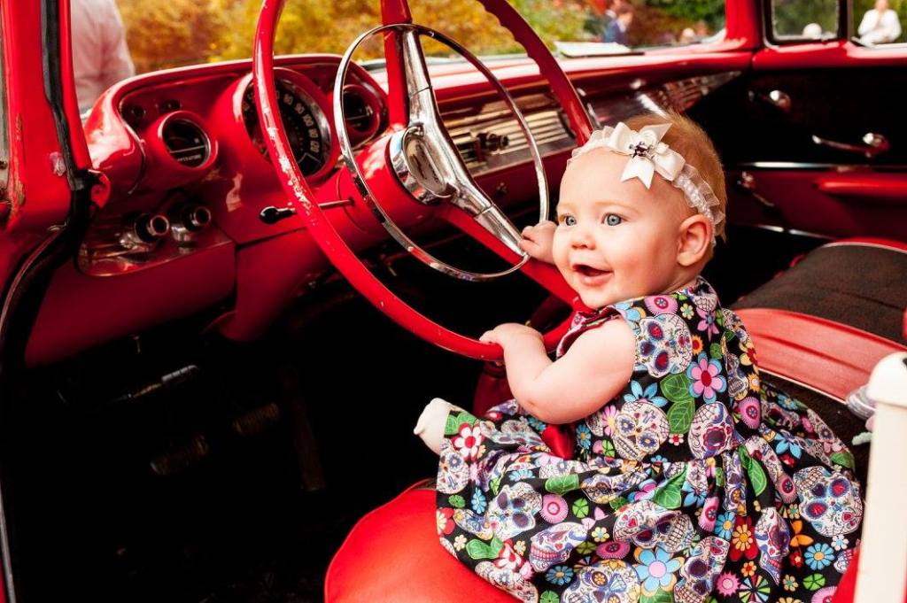 Halloween Rockabilly Themed Wedding - Baby Girl Sitting Inside Red Cadillac